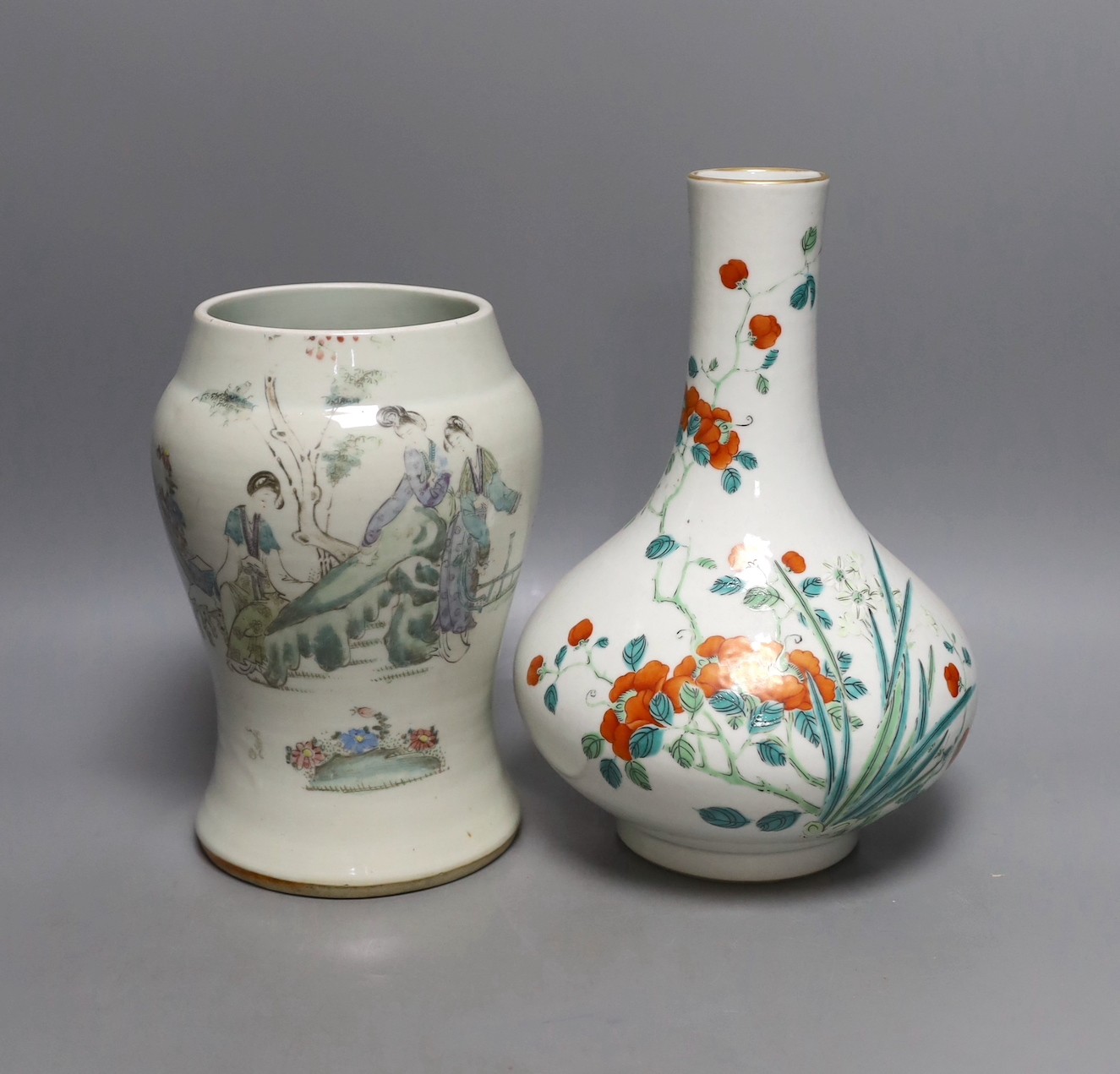 A Chinese enamelled porcelain bottle vase, 25cm high, together with a Chinese porcelain baluster jar, early 20th century, painted with figures and script